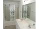 This bathroom offers double sinks, a shower/tub combo, and neutral decor at 2662 Walas Ct, Creedmoor, NC 27522