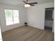 This bedroom features a ceiling fan, ample natural light, and neutral carpeting at 2662 Walas Ct, Creedmoor, NC 27522