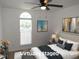 Staged bedroom featuring a large window, soft lighting, and coordinated decor at 2662 Walas Ct, Creedmoor, NC 27522