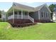 Charming single-story home with a brick foundation, cozy front porch, and a well-manicured front yard at 2662 Walas Ct, Creedmoor, NC 27522