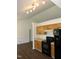 Bright eat-in kitchen features wood cabinets, black appliances, and wood flooring at 2662 Walas Ct, Creedmoor, NC 27522