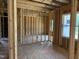The framed interior reveals a light-filled room with a window, showcasing potential living space at 299 Little Lady Trail, Zebulon, NC 27597
