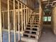Wooden staircase framing provides a glimpse into the future design and flow of the new home at 299 Little Lady Trail, Zebulon, NC 27597