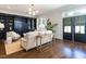 Living room features built-in shelving, hardwood floors, neutral paint, and lots of natural light at 300 W Roanoke Park Dr, Raleigh, NC 27608