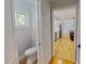 Bathroom with toilet and view of kitchen at 303 Winhaven St, Roxboro, NC 27573
