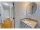 Bathroom sink and vanity with granite countertop and gray cabinetry at 303 Winhaven St, Roxboro, NC 27573