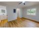 Bedroom featuring vinyl flooring, neutral paint, a modern barn door and bathroom access at 303 Winhaven St, Roxboro, NC 27573
