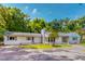 Charming single-story home with a landscaped front yard and grey brick chimney at 303 Winhaven St, Roxboro, NC 27573
