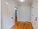 Hallway with hardwood floors and white trim at 303 Winhaven St, Roxboro, NC 27573