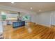 Open concept kitchen with island, stainless steel appliances, and hardwood floors at 303 Winhaven St, Roxboro, NC 27573