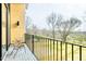 Balcony with wrought iron railing offers serene views with modern chairs and exterior wood finishes at 322 S Dixon Ave # R, Cary, NC 27511