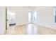 Bright bedroom features wood floors, white walls, and a private door to a balcony and bathroom at 322 S Dixon Ave # R, Cary, NC 27511