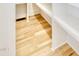 Walk-in closet with built in shelves and wood flooring at 322 S Dixon Ave # R, Cary, NC 27511