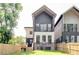 Back exterior view of the two-story home with a deck, a balcony, and fenced backyard at 322 S Dixon Ave # R, Cary, NC 27511