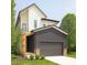 Contemporary home showcasing a mix of white and dark gray siding, complemented by green landscaping at 322 S Dixon Ave # R, Cary, NC 27511