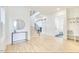 Bright entryway with hardwood floors, a staircase, and a view into the bathroom at 322 S Dixon Ave # R, Cary, NC 27511
