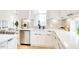 Bright and functional kitchen with stainless appliances, white cabinets and updated backsplash at 322 S Dixon Ave # R, Cary, NC 27511