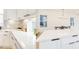 Bright, updated kitchen featuring white cabinets, quartz countertops, and modern backsplash at 322 S Dixon Ave # R, Cary, NC 27511