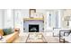 Charming living room with fireplace, hardwood flooring, and stylish decor at 322 S Dixon Ave # R, Cary, NC 27511
