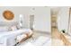 Inviting bedroom with light-filled hall, featuring modern furnishings and natural wood floors for a cozy ambiance at 322 S Dixon Ave # R, Cary, NC 27511