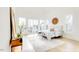 Light and airy main bedroom with a vaulted ceiling, balcony access, and modern decor create a peaceful retreat at 322 S Dixon Ave # R, Cary, NC 27511