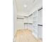 Organized walk-in closet features custom shelving and rod system to maximize storage space and convenience at 322 S Dixon Ave # R, Cary, NC 27511