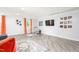 Basement area featuring a large television, and ample space for entertainment, illuminated by natural light at 3315 Swepsonville Saxapahaw Rd, Graham, NC 27253
