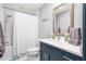 Well-lit bathroom featuring a shower-tub combination, new vanity, and modern fixtures at 3315 Swepsonville Saxapahaw Rd, Graham, NC 27253