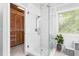 Modern bathroom features a walk-in glass shower and closet at 3315 Swepsonville Saxapahaw Rd, Graham, NC 27253