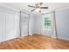 Inviting bedroom featuring hardwood floors, natural light and a spacious closet at 3315 Swepsonville Saxapahaw Rd, Graham, NC 27253
