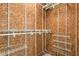 Well-organized walk-in closet with wire shelving and wood paneling at 3315 Swepsonville Saxapahaw Rd, Graham, NC 27253