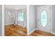 Inviting entryway leading to a well-lit room with hardwood floors and a scenic window at 3315 Swepsonville Saxapahaw Rd, Graham, NC 27253