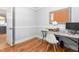 Bright home office with hardwood floors, neutral paint, and a cork bulletin board at 3315 Swepsonville Saxapahaw Rd, Graham, NC 27253