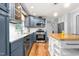 Well-equipped kitchen with stainless steel appliances, subway tile backsplash, island, and ample counter space at 3315 Swepsonville Saxapahaw Rd, Graham, NC 27253