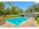 Backyard pool surrounded by lush greenery and the home's exterior at 3315 Swepsonville Saxapahaw Rd, Graham, NC 27253