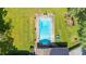 A top down aerial view of the rectangular inground pool and surrounding green backyard at 3315 Swepsonville Saxapahaw Rd, Graham, NC 27253