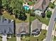 An aerial view of upscale homes with manicured lawns, mature trees, and fenced backyards at 503 Bendemeer Ln, Rolesville, NC 27571