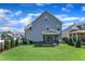 Well-maintained backyard with lush green grass, black fence, and an inviting screened-in porch at 503 Bendemeer Ln, Rolesville, NC 27571
