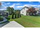 Large backyard featuring an extended patio, lush greenery, and a classic fence at 503 Bendemeer Ln, Rolesville, NC 27571