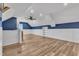 Finished basement area featuring modern flooring, bright lighting and crisp blue accents at 503 Bendemeer Ln, Rolesville, NC 27571