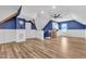 Finished basement featuring stylish blue accents, modern lighting, and wood-look flooring at 503 Bendemeer Ln, Rolesville, NC 27571