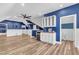 Finished basement area featuring a wet bar with modern accents and stylish flooring at 503 Bendemeer Ln, Rolesville, NC 27571