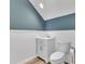 Cozy bathroom with white vanity, marble countertop, and modern toilet at 503 Bendemeer Ln, Rolesville, NC 27571
