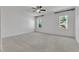 This well-lit bedroom has two windows, plush carpeting, and a ceiling fan at 503 Bendemeer Ln, Rolesville, NC 27571