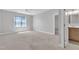 Spacious bedroom featuring a ceiling fan, neutral carpeting, and a private ensuite bathroom at 503 Bendemeer Ln, Rolesville, NC 27571