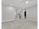 Bright bedroom with neutral walls, carpeted flooring, and staircase access to other levels at 503 Bendemeer Ln, Rolesville, NC 27571
