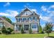 Charming two-story home with stone accents, manicured lawn, and inviting front porch at 503 Bendemeer Ln, Rolesville, NC 27571