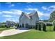 Spacious two-story home with a well-manicured lawn, mature trees, and a two-car garage at 503 Bendemeer Ln, Rolesville, NC 27571