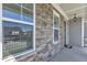 Charming front porch with stone detailing, ample natural light, and a welcoming entrance at 503 Bendemeer Ln, Rolesville, NC 27571