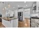 Open kitchen with granite countertops, stainless appliances and hardwood floors at 503 Bendemeer Ln, Rolesville, NC 27571